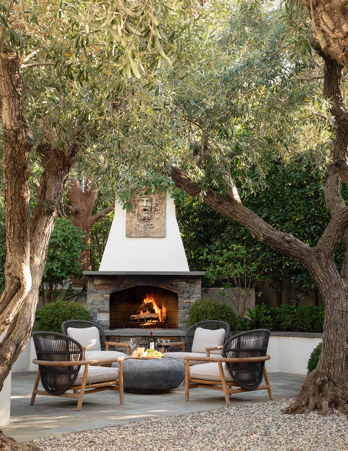 Outdoor sitting area with fireplace | Jack Haley Exterior | Eco-Luxury Landscape Architecture + Design | Westside Los Angeles